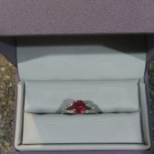 Pink sapphire and diamond ring